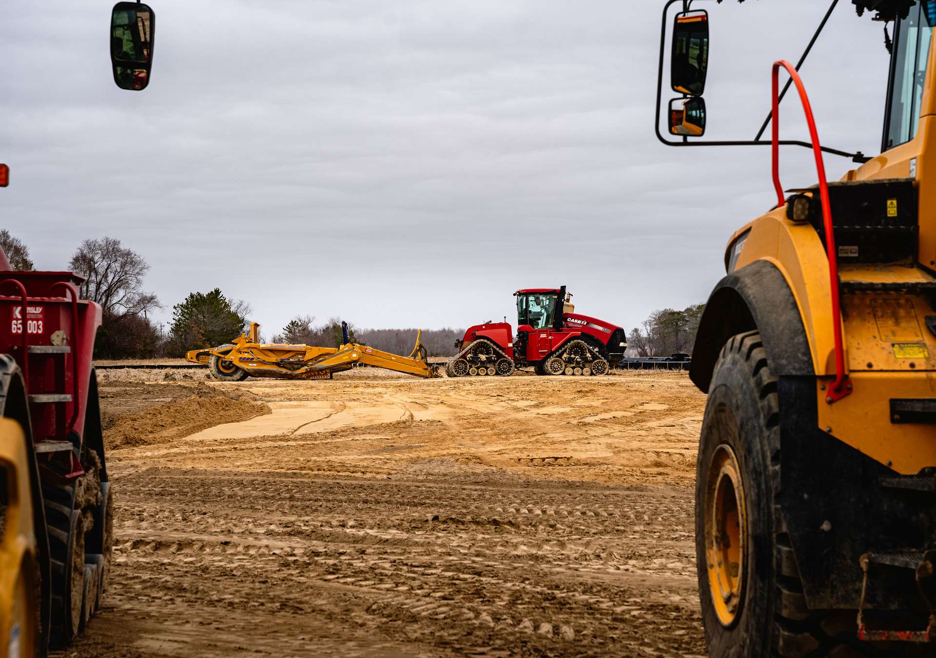dagsboro-office-article-hero A construction site features heavy machinery under an overcast sky.